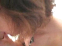 Mature in stockings plays with dick